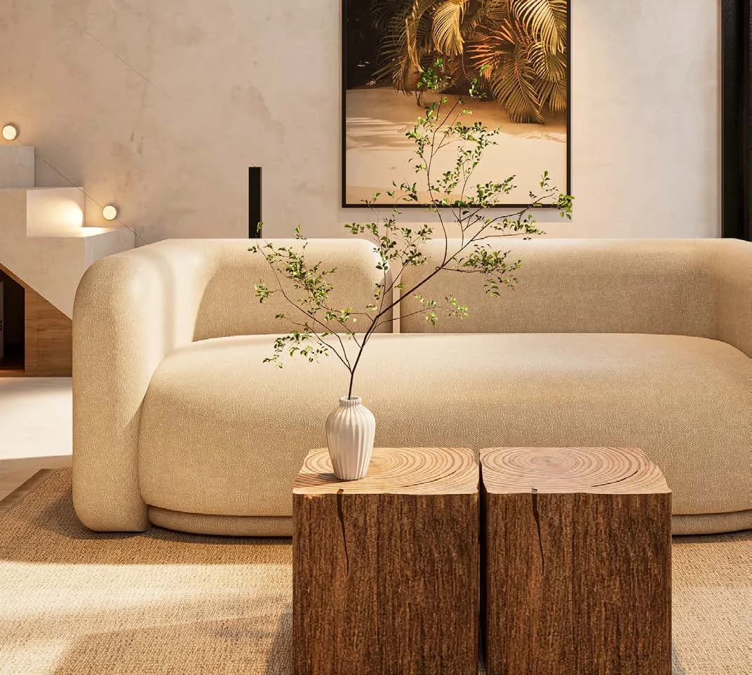 Séjour meublé d’une villa du programme, avec canapé et lumière naturelle